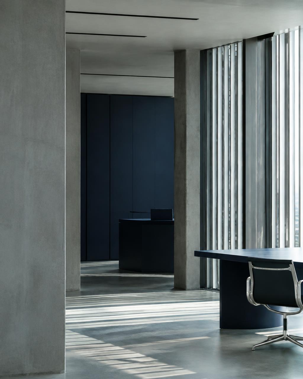 Minimalist office with concrete columns and slatted light